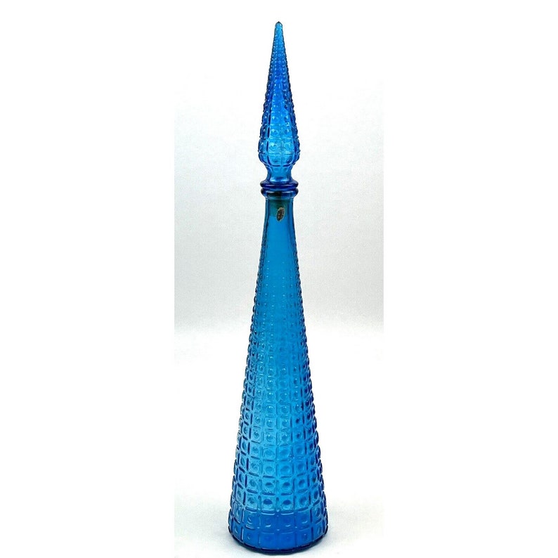 Tall blue decorative glass bottle with raised geometric patterns
