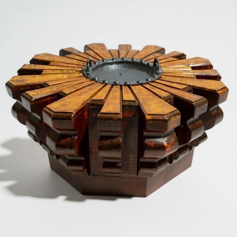 Dark wooden octagonal table with a sculptural carved top